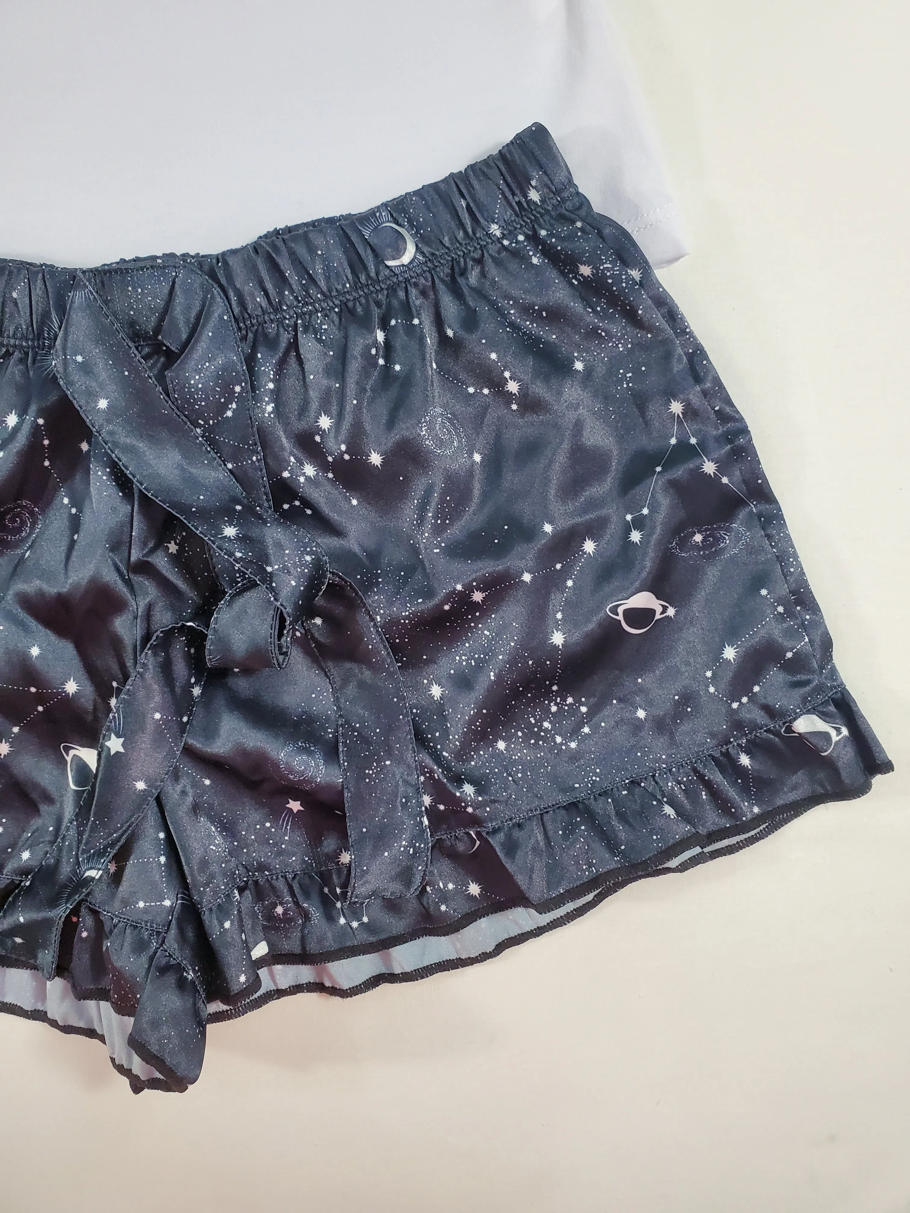 Women's Mellow satin pajamas black shorts with outer space theme white blouse