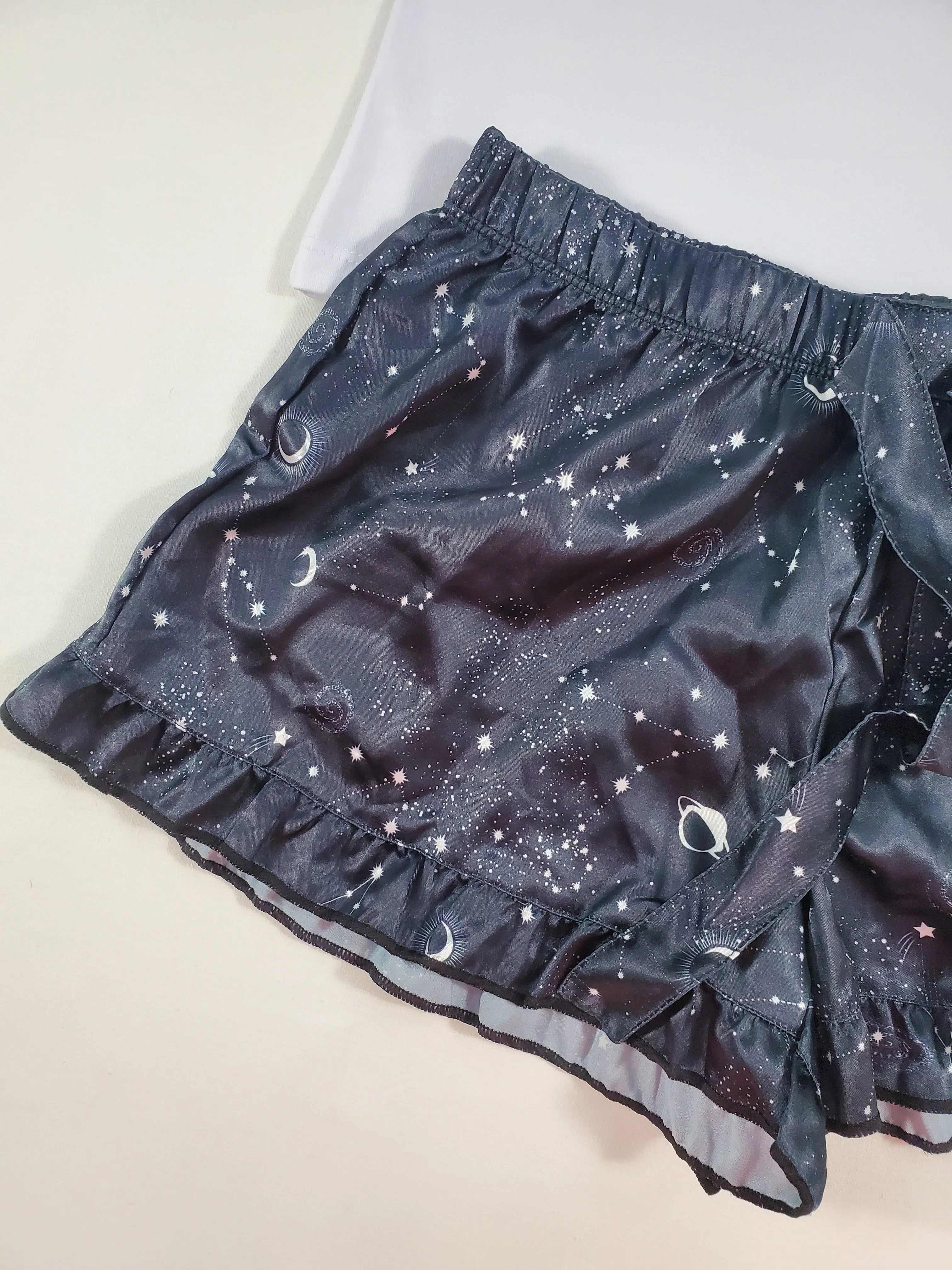 Women's Mellow satin pajamas black shorts with outer space theme white blouse